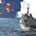 Tanker sinks, but flames persist on surface of the sea