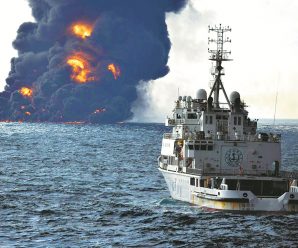 Tanker sinks, but flames persist on surface of the sea