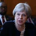 May apologizes to postwar migrants