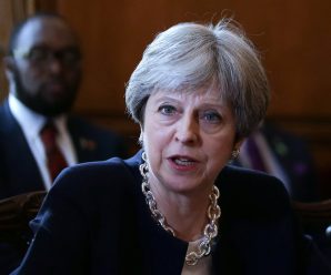 May apologizes to postwar migrants